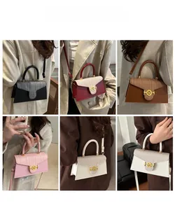 Close-up of stylish mini square bags in six colors with gold M-buckle hardware
