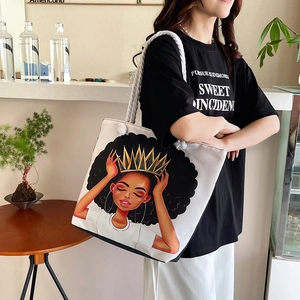Detail of canvas tote bag with African queen illustration and cotton rope handles