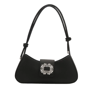 Chic black leather baguette underarm bag with crystal buckle and knotted strap detail