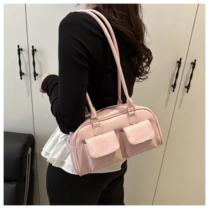 Pink PU leather underarm bag with front flap pockets and golden zipper detail