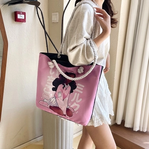 Close-up of pink canvas tote bag featuring rope handles and anime girl illustration