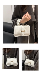 Detail of white quilted crossbody bag with golden buckle and versatile carrying options