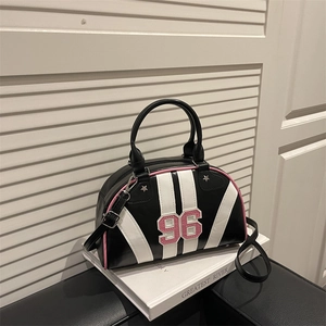 Retro striped bowling bag with pink 96 embroidery and star rivets on white books