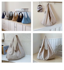 Detail of colorful nylon tote bags showing wrinkled texture and side drawstring toggles