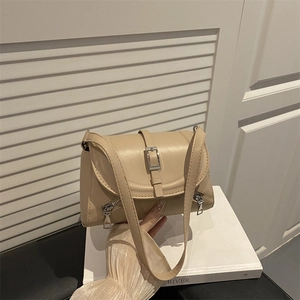Elegant cream leather shoulder bag for women with silver buckle and flap closure design