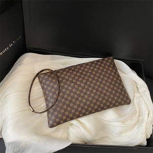 Brown vintage envelope clutch bag with geometric patterns on elegant white satin