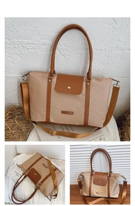 Detailed macro of a color-block tote bag with leather trim and fashion logo plate
