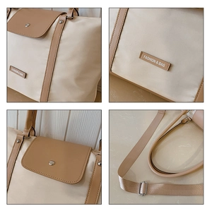 Detail view of beige nylon and brown leather patchwork tote bag with adjustable strap