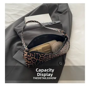 Interior view showing the large capacity of the leopard print shoulder bag