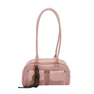 Pink faux leather shoulder bag with utility pockets and a tennis racket charm