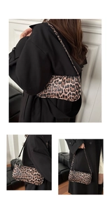 Detail view of stylish leopard print underarm bag with slim shoulder strap and slim design