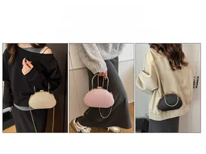 Three elegant evening clutch bags in gold, pink and black with stylish metal chain straps