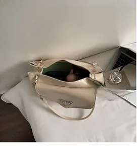 Interior view of cream tote bag showing spacious storage for a tablet and phone