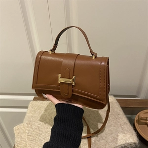 Brown faux leather crossbody bag with rhombic stitching and gold hardware buckle