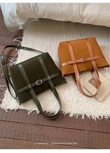 Detail of wool fabric and leather straps on retro tote bags in green and tan shades