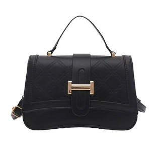 Classic black quilted shoulder bag with gold metal lock and elegant curved base design