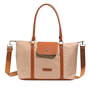 Large khaki nylon tote bag with brown leather accents and adjustable shoulder strap
