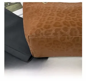 Close-up of leopard print tote bag showing premium stitching and matte texture details