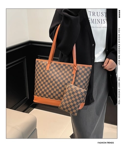 Detailed view of the large brown checkered tote bag with a matching small coin purse