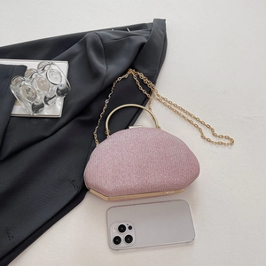 Pink glitter evening clutch bag with round gold handle and detachable chain strap
