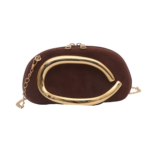 Brown suede half-moon evening bag with large gold C-shaped metal handle and chain strap