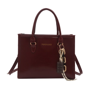 Deep red large capacity tote bag with fashion & bags lettering and chocolate charm