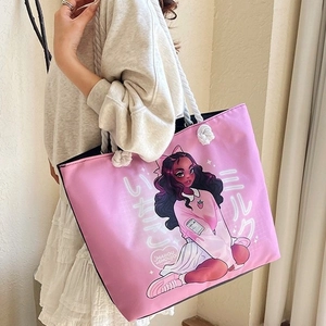 Pink canvas tote bag with anime girl print and rope handles shown from 45-degree angle