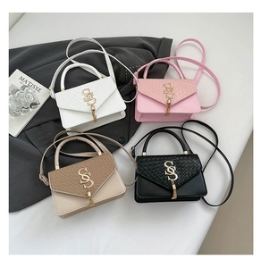 Flat lay of four stylish PU leather crossbody bags in white, pink, khaki, and black colors