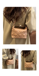 Detail of beige quilted handbag showing heart stitching and metallic lock on leather texture