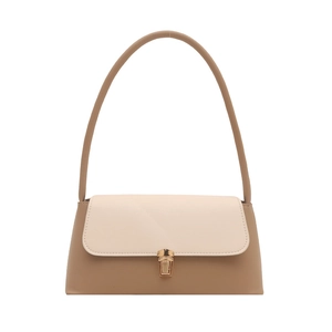 Two-tone baguette shoulder bag in cream and tan leather with a golden metallic clasp