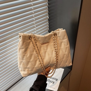 Chic beige quilted shoulder bag with gold chain strap and elegant diamond stitch