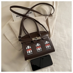 Detail of dark brown crocodile texture handbag with unique colorful window pattern collage