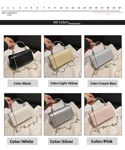 Detail view of colorful glossy patent leather chain bags with metal ring handles