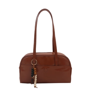 Classic brown leather bowling bag for women with wooden bead charm and long shoulder straps