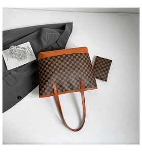 Detail of checkered tote bag set with matching pouch and stylish office accessories