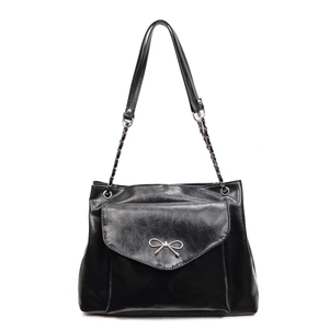 Minimalist black faux leather tote bag with silver bow accent and chain shoulder strap