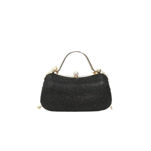 Elegant black glitter evening clutch with gold metal handle and sparkling rhinestone clasp