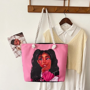 Pink canvas tote bag with cotton rope handles and artistic character print design
