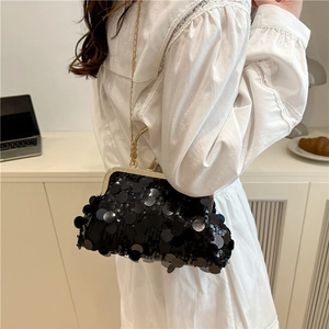 Elegant black sequin clutch bag with metal frame and gold chain strap for evening events