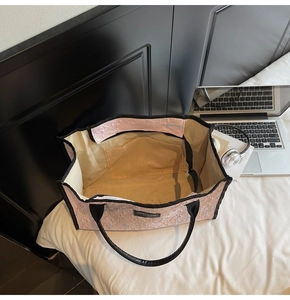 Top view of pink tote bag showing spacious interior with lining and small inner pocket