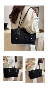 Detail of black leopard print tote bag featuring textured animal pattern and slender straps