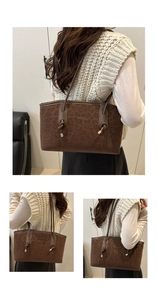 Detail of leopard print tote bag featuring textured material and knot strap details