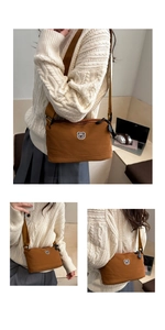 Detail of brown nylon crossbody bag with cute bear patch and adjustable shoulder strap