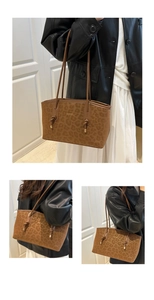 Close-up of leopard print tote bag with brown matte finish and metal knotted strap details