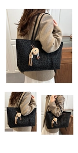 Detail of vintage leopard print tote bag with soft fabric texture and plush charm