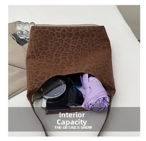 Internal view of the leopard print tote bag showing large capacity for daily items
