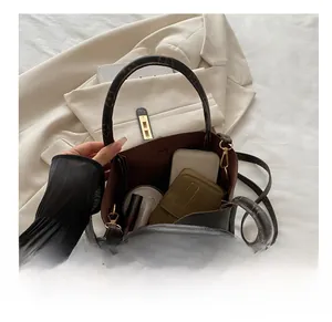 Detail view of the large capacity tote bag interior with storage for wallet and phone