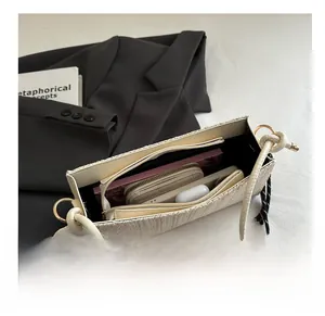Interior view of beige woven tote bag showing space for wallet, phone and daily essentials