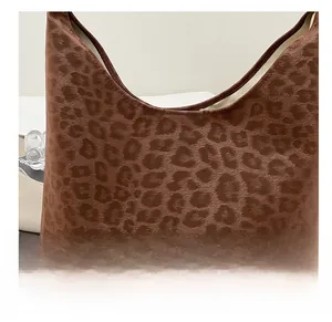 Close-up of the leopard print fabric texture on a large capacity tote bag