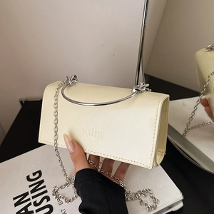 Chic cream rectangular chain crossbody bag with semi-circular silver metal handle and logo